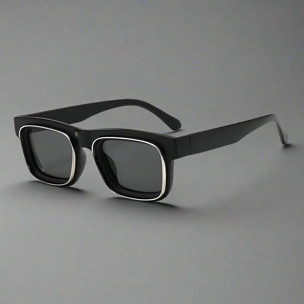 Black sunglasses with dark lenses on a white background