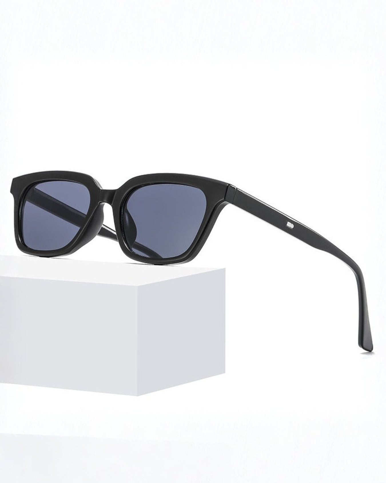 Black sunglasses with blue lenses on a white background