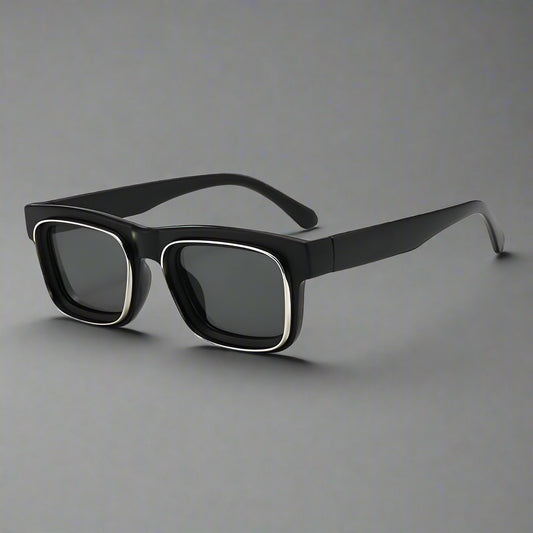 Black sunglasses with dark lenses on a white background