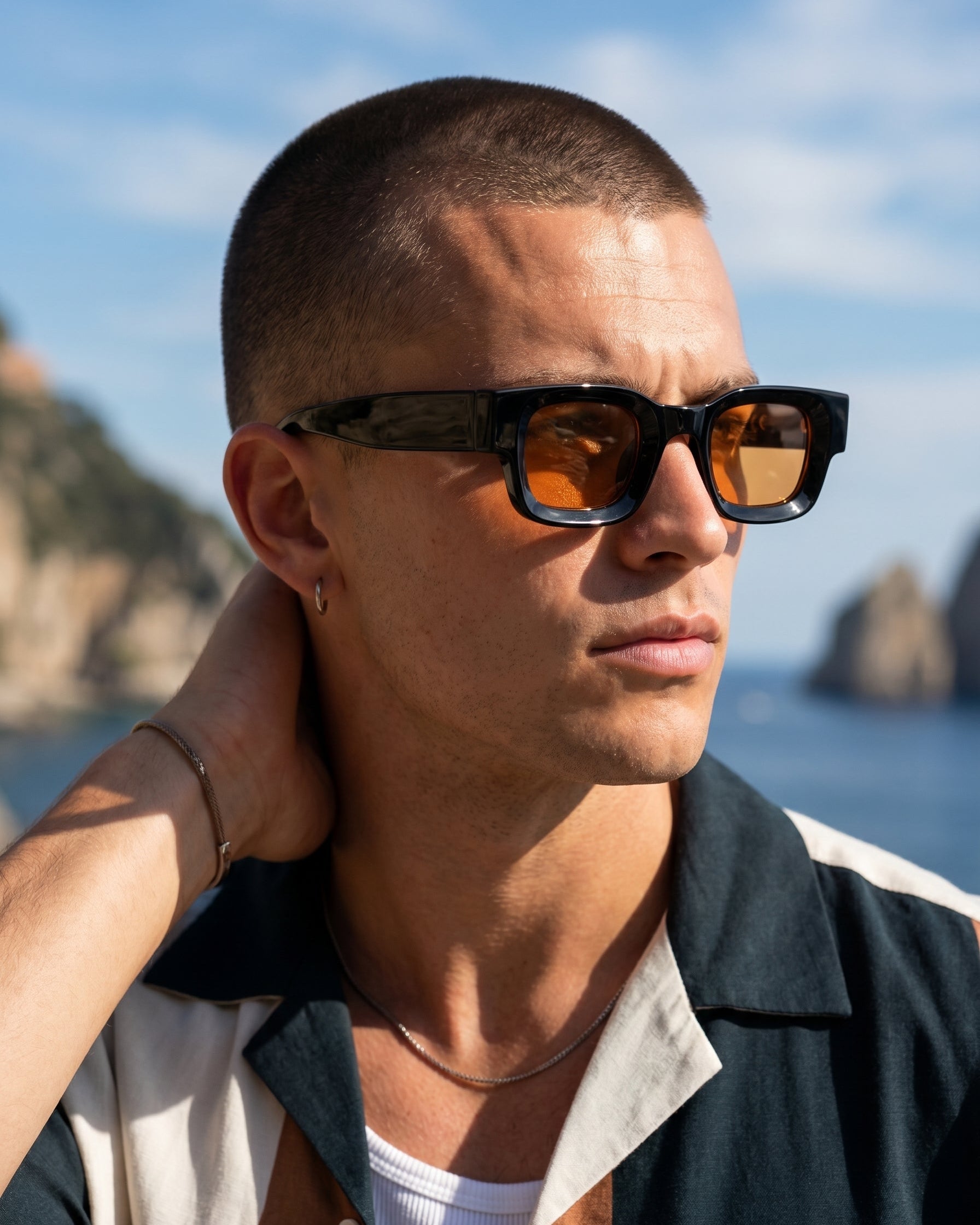 Man wearing sunglasses with a scenic background
